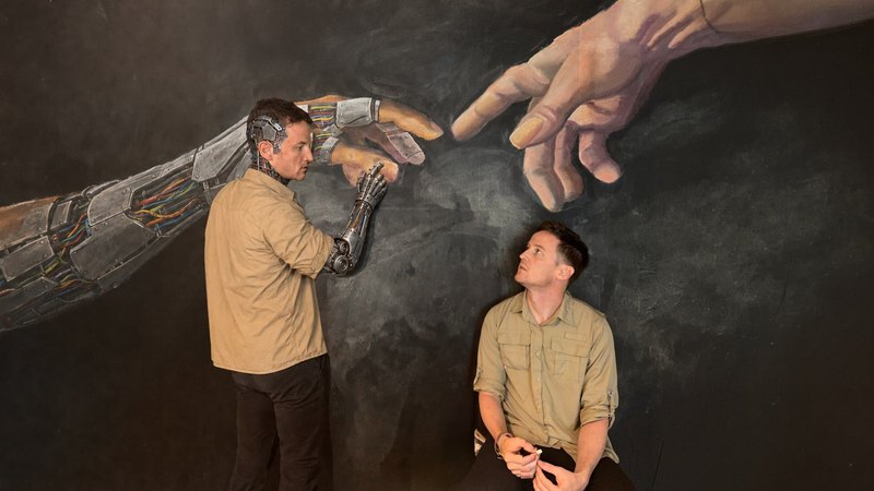 Lance and an AI version of himself drawing together at a chalk wall
